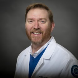 Headshot of Collins Rainey, Assistant Dean OMS-3