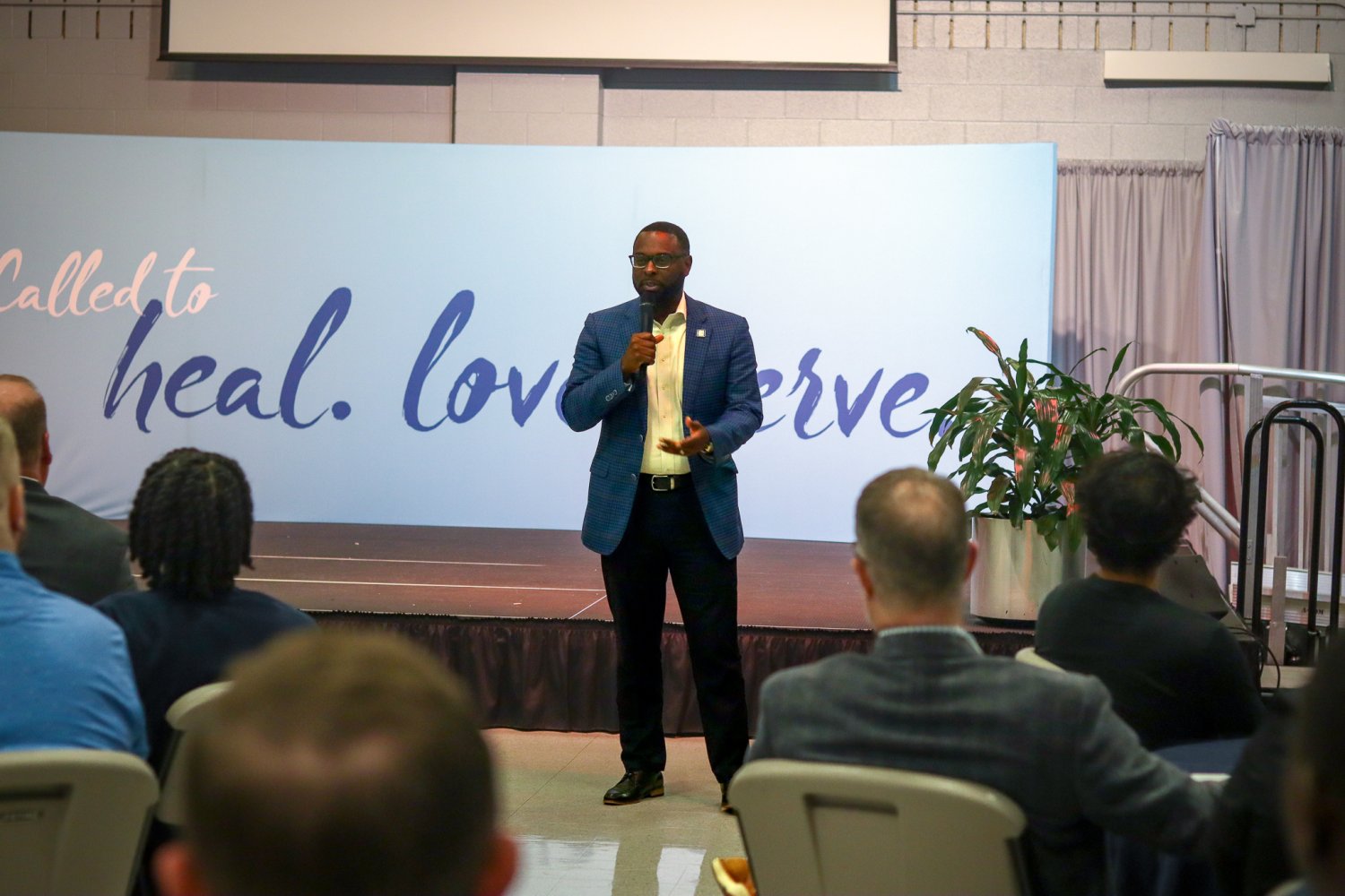 Memphis Mayor Paul Young speaking to students and professionals from stage at Baptist Health Sciences University’s Future Men in Healthcare Networking Event.