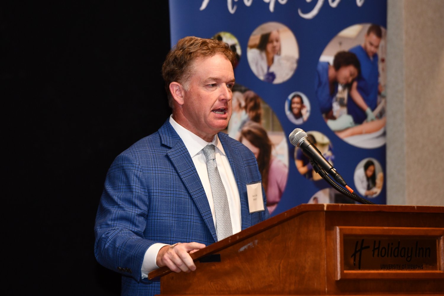 Jason Little giving a speech 