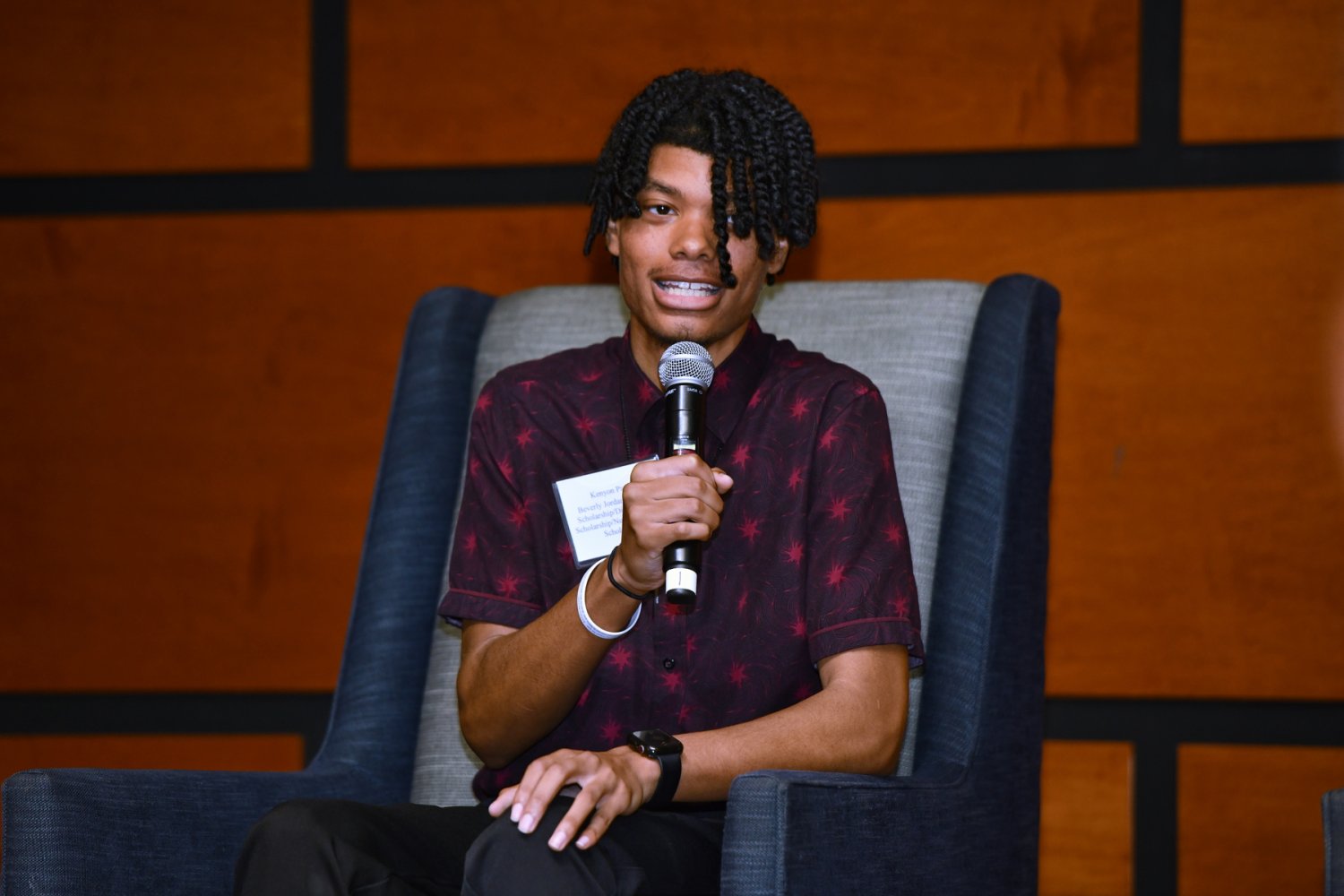 Kenyon speaking on a panel