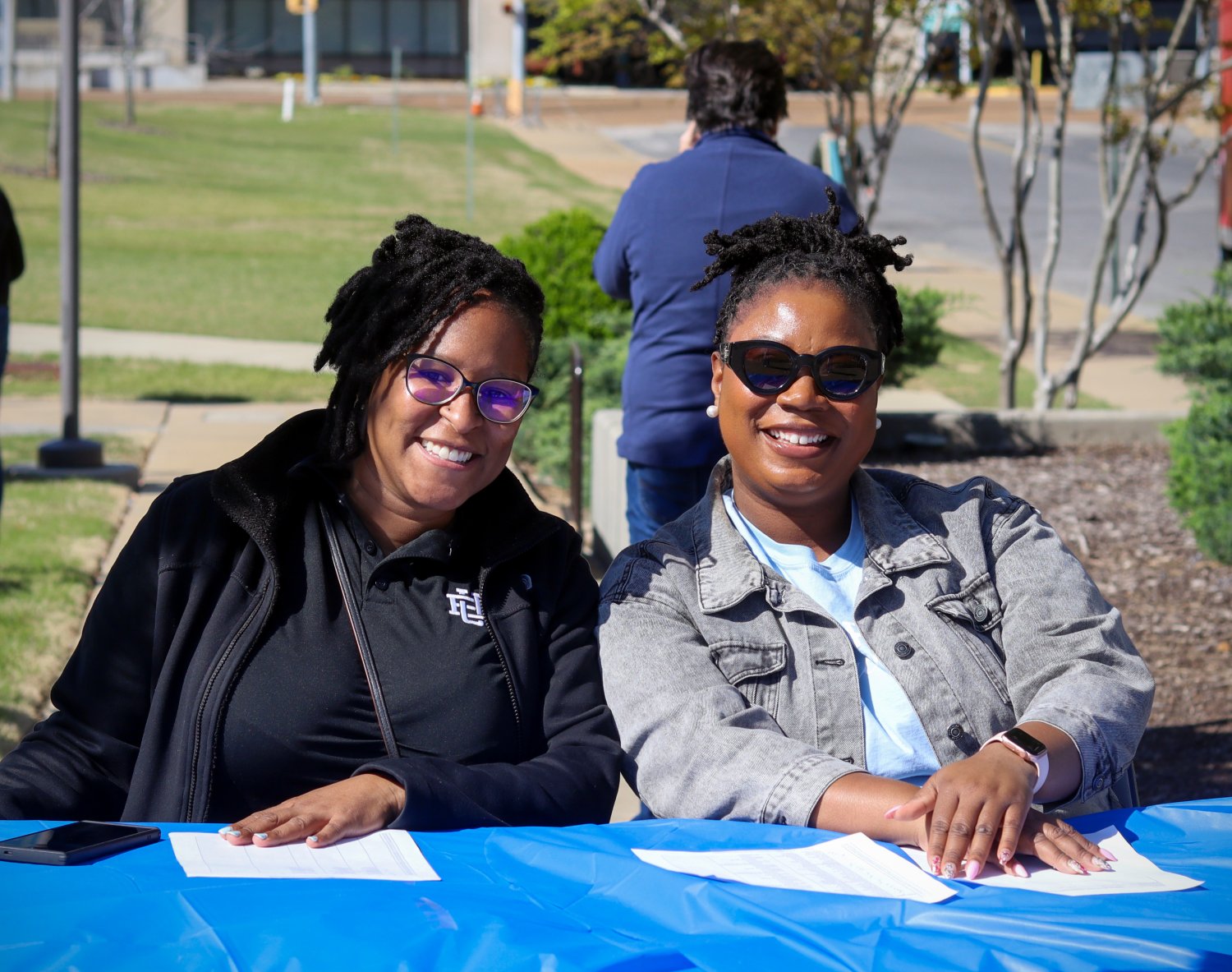 two people smiling at the camera