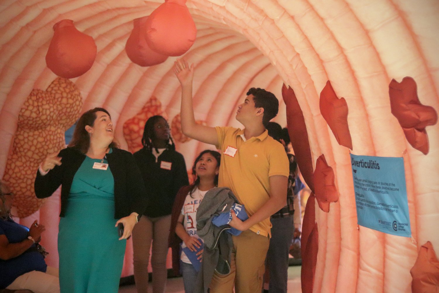 student and professor walking through an inflatable lung 