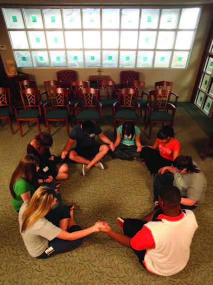 Student sitting in a circle in the chapel