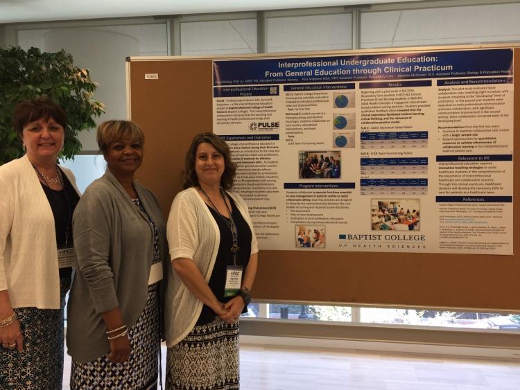 Faculty presenting an IPE Poster Presentation