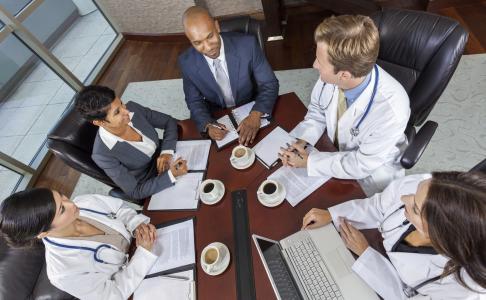 medical professionals at a conference table