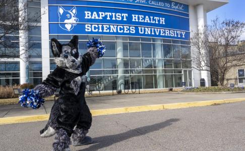 Hartley in front of the Collaboration Building